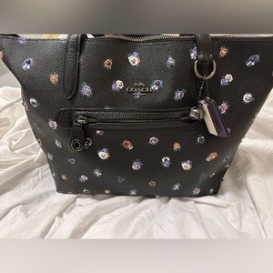 Brand new one of a kind coach purse receipt, and dust bag included.